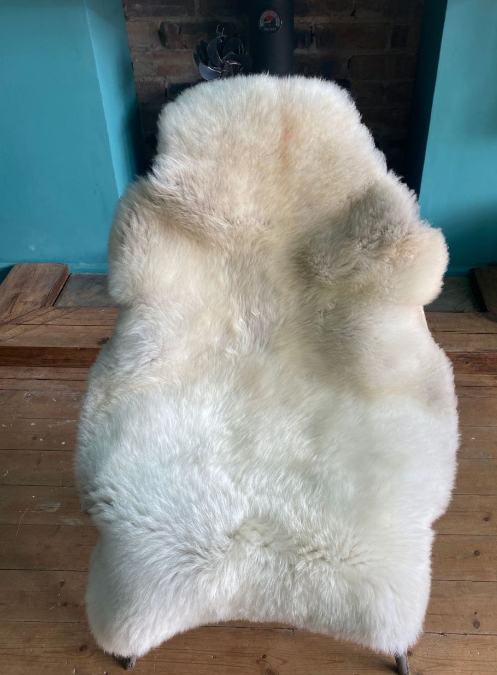 Cream sheepskin rug on chair