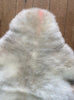 Cream sheepskin rug close up 