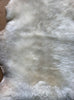 Cream sheepskin rug close up 