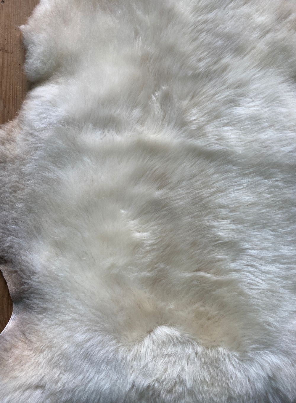 Cream sheepskin rug close up 