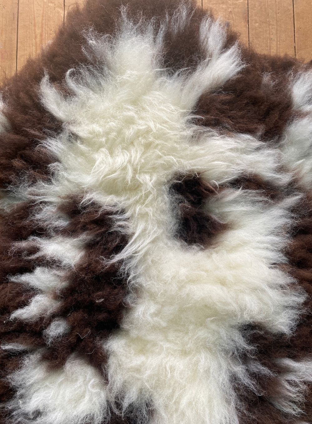 Cream and brown sheepskin rug close up