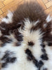 Cream and brown spotty sheepskin rug close up