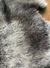 Grey sheepskin rug close up