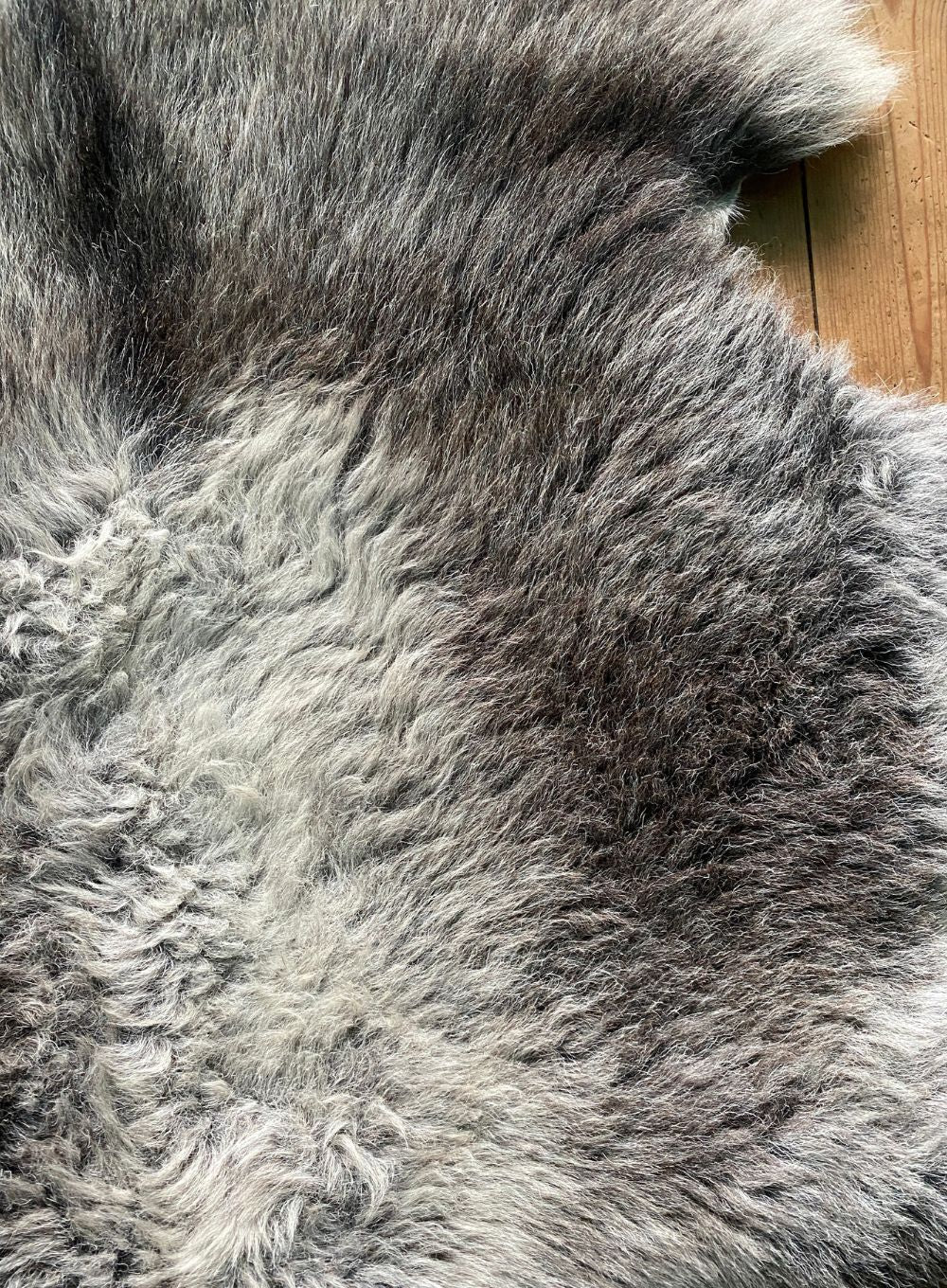 Grey sheepskin rug close up