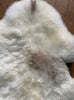 Cream sheepskin rug close up