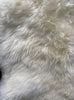 Cream sheepskin rug close up