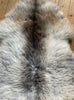 Brown and grey sheepskin rug close up