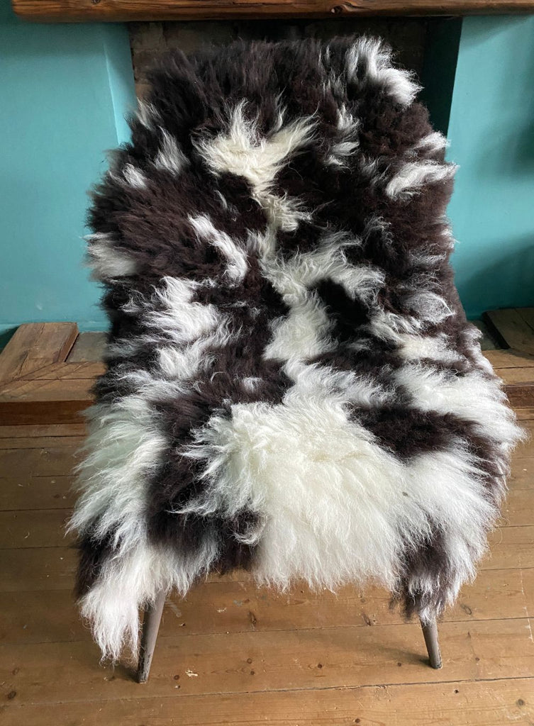 Brown and cream spotty sheepskin on chair