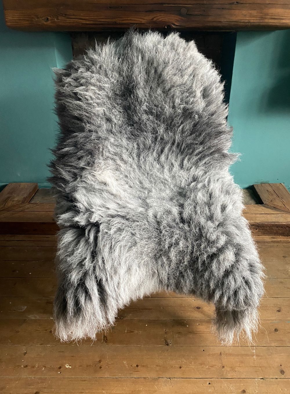 Grey sheepskin rug on chair