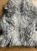 Grey sheepskin rug close up