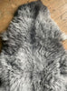 Grey sheepskin rug close up