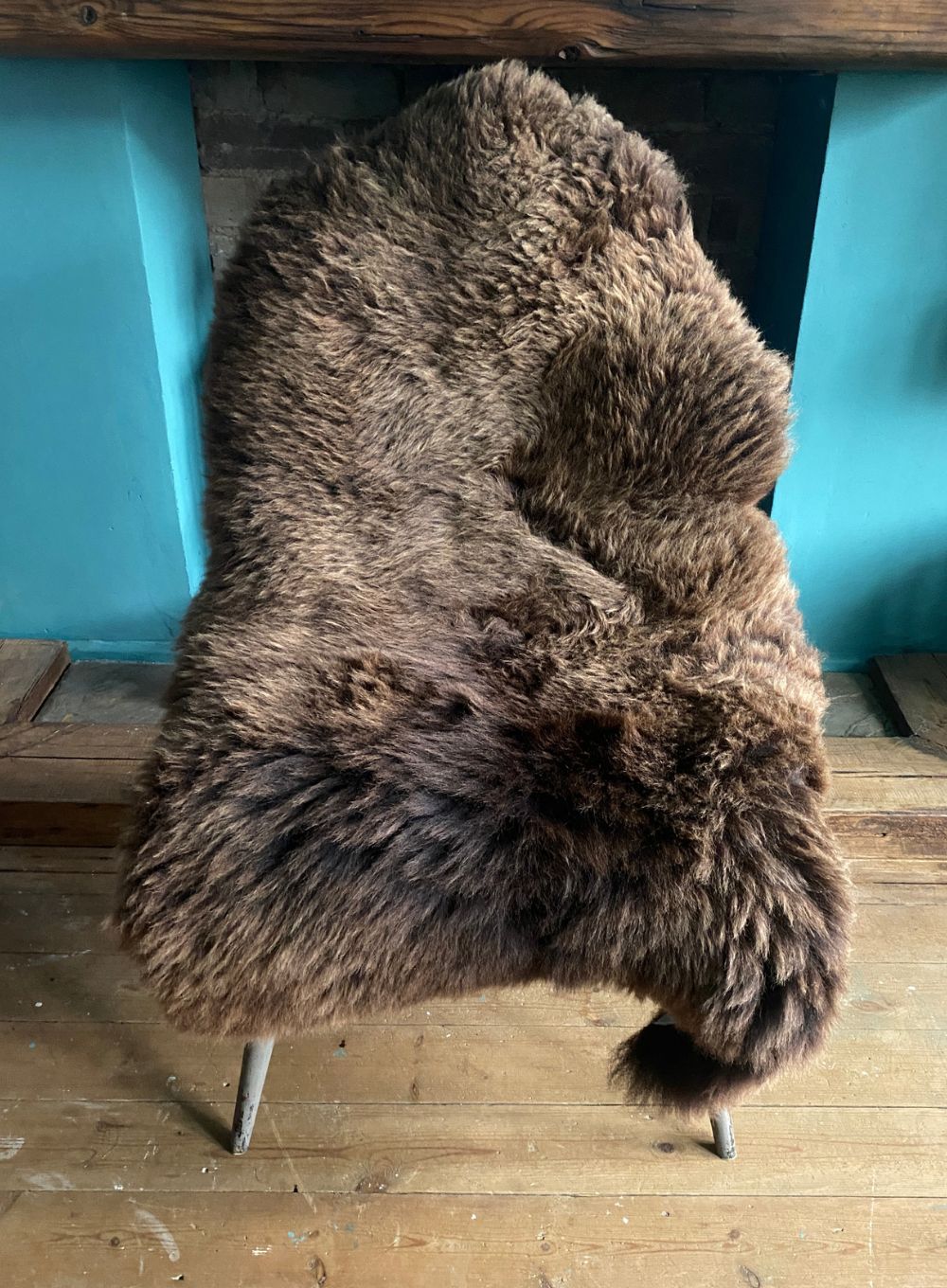 Brown sheepskin rug on chair 