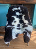 Brown and cream sheepskin rug on chair