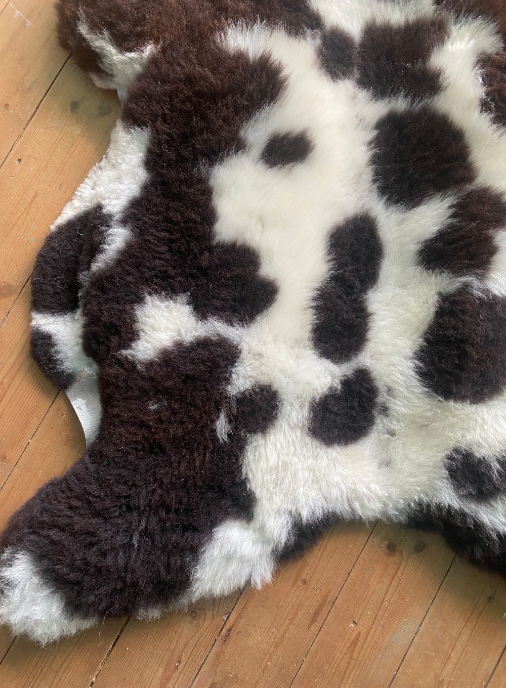 Brown and cream sheepskin rug close up 