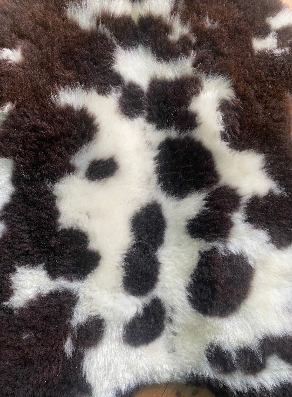Brown and cream sheepskin rug close up 