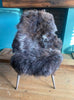 Brown sheepskin rug on chair