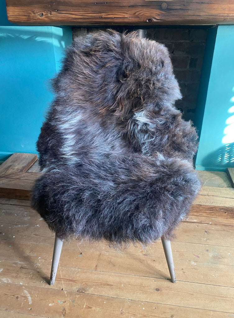 Brown sheepskin rug on chair