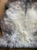 Brown and grey sheepskin rug close up