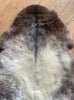 Brown and grey sheepskin rug close up