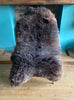Brown sheepskin rug on chair