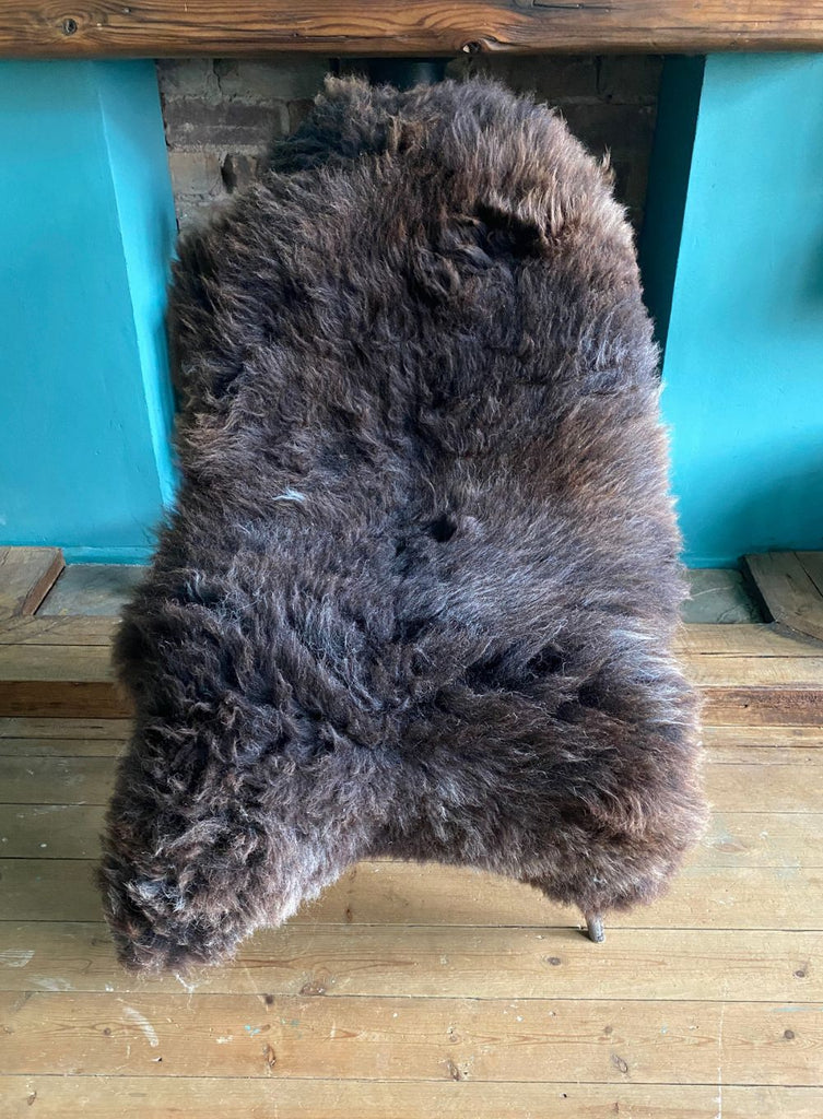 Brown sheepskin rug on chair