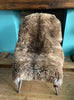 Brown sheepskin rug on chair