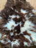 Brown and cream sheepskin rug close up