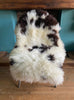 Brown and cream spotty sheepskin on chair