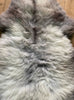 Grey and cream sheepskin rug close up