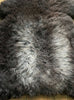Dark brown sheepskin rug close up