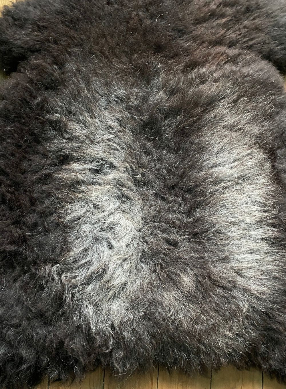 Dark brown sheepskin rug close up