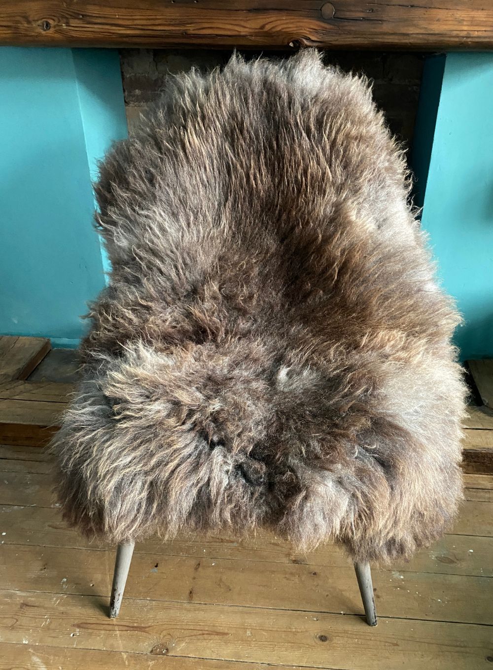 Brown sheepskin rug on chair
