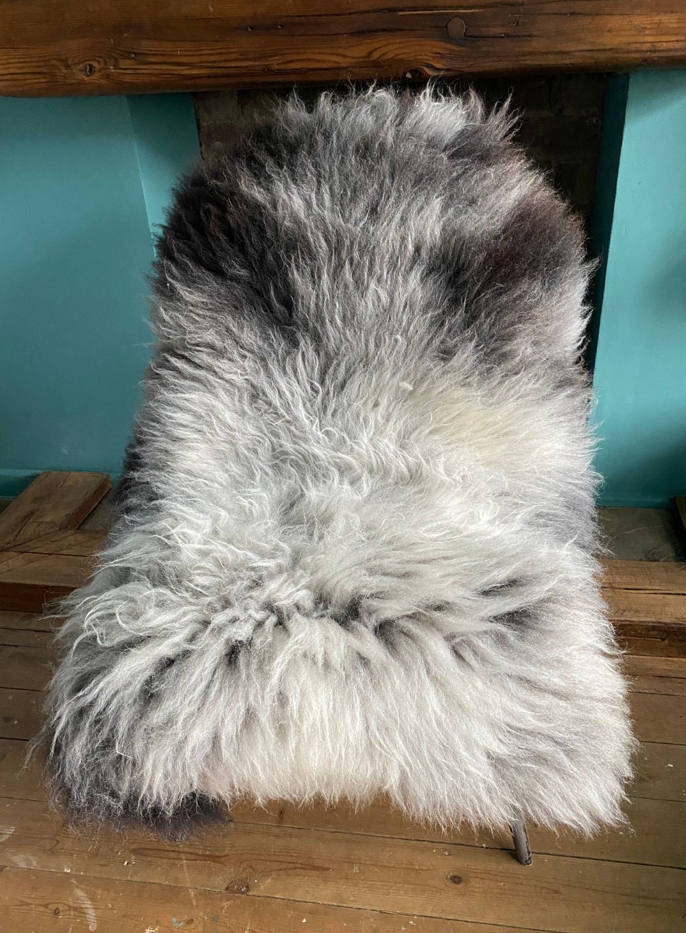 Grey sheepskin rug on chair