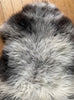 Grey sheepskin rug close up