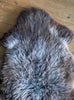 Brown and grey sheepskin rug close up
