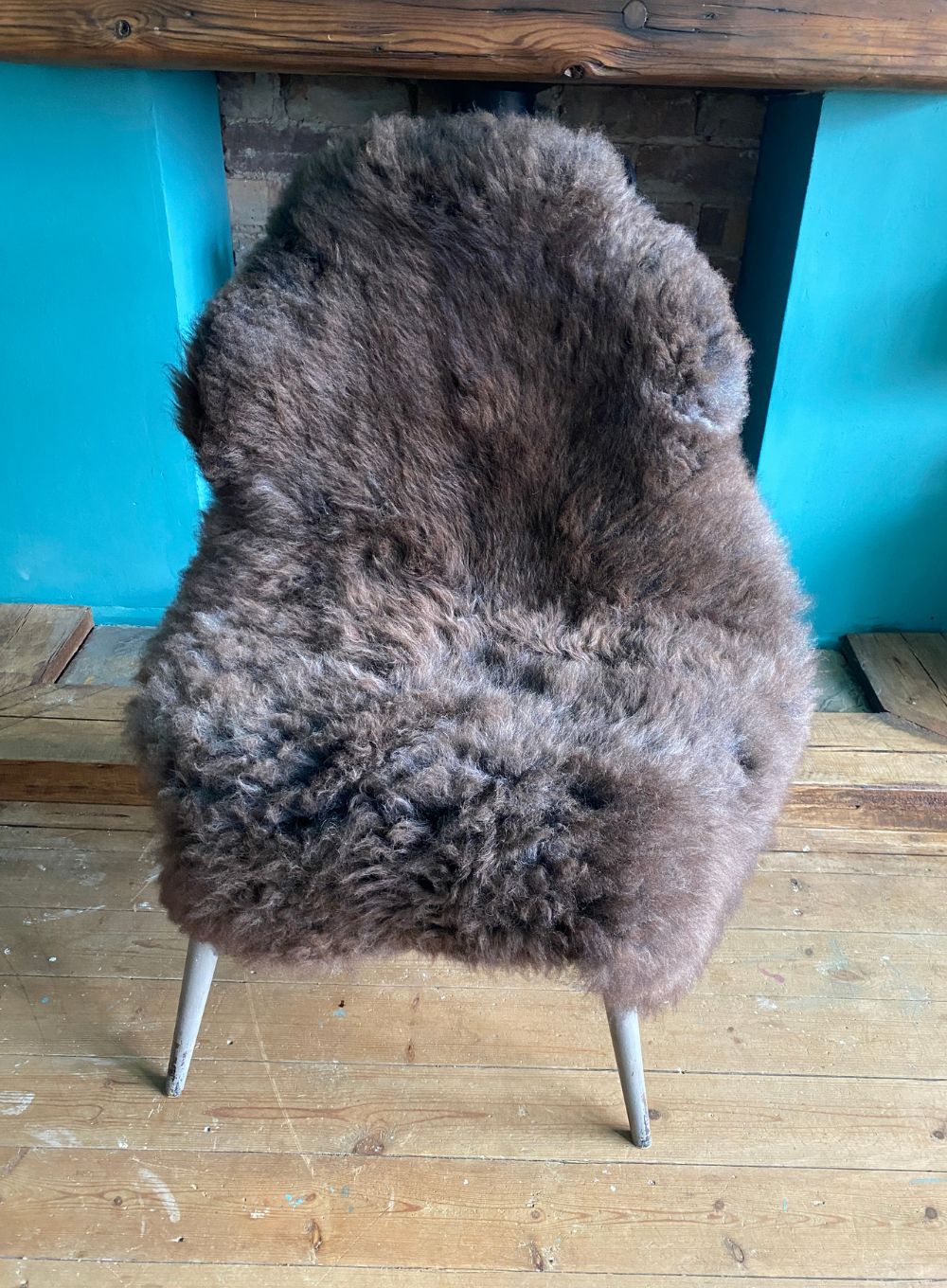 Brown sheepskin rug on chair
