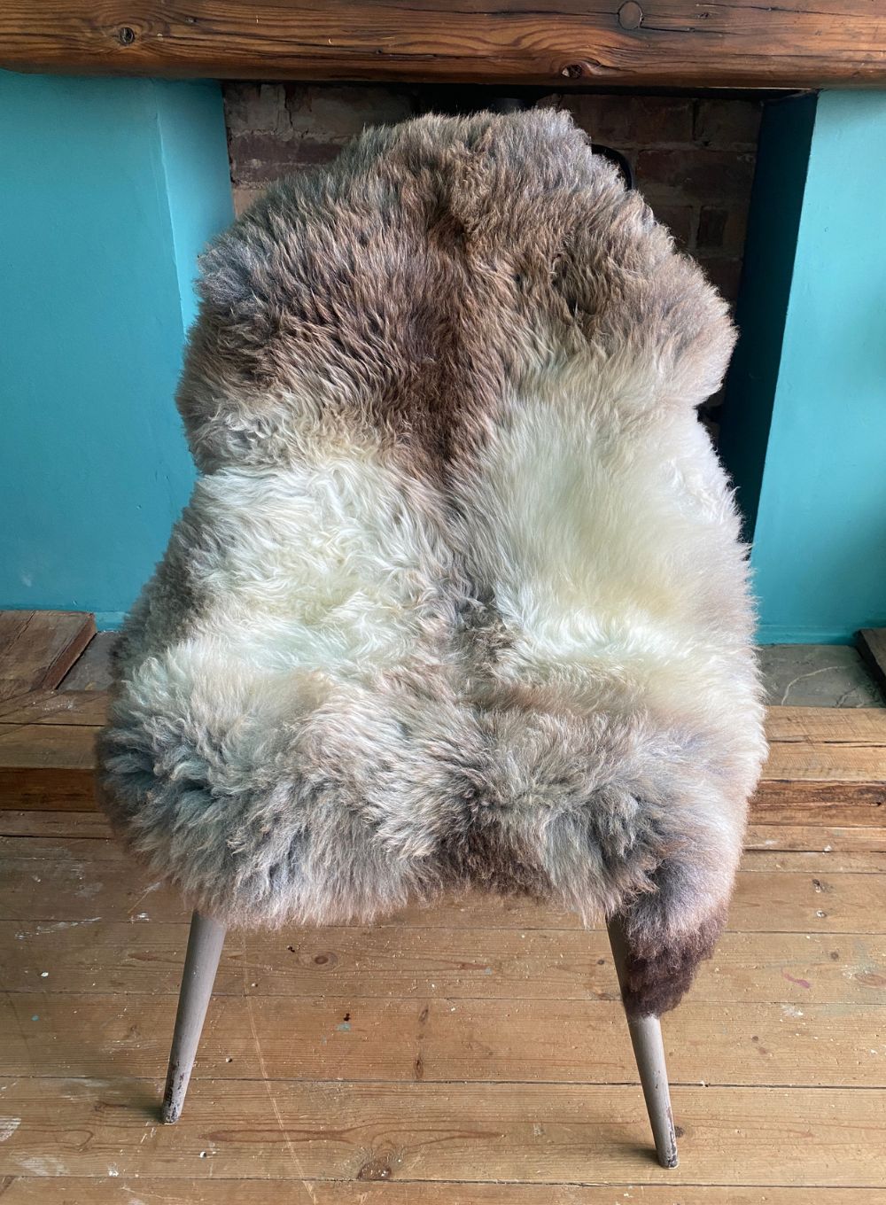Grey and brown sheepskin rug on chair