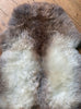 Grey and brown sheepskin rug close up