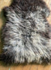 Grey sheepskin rug close up