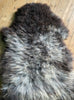 Grey sheepskin rug close up
