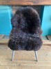 Brown sheepskin rug on chair