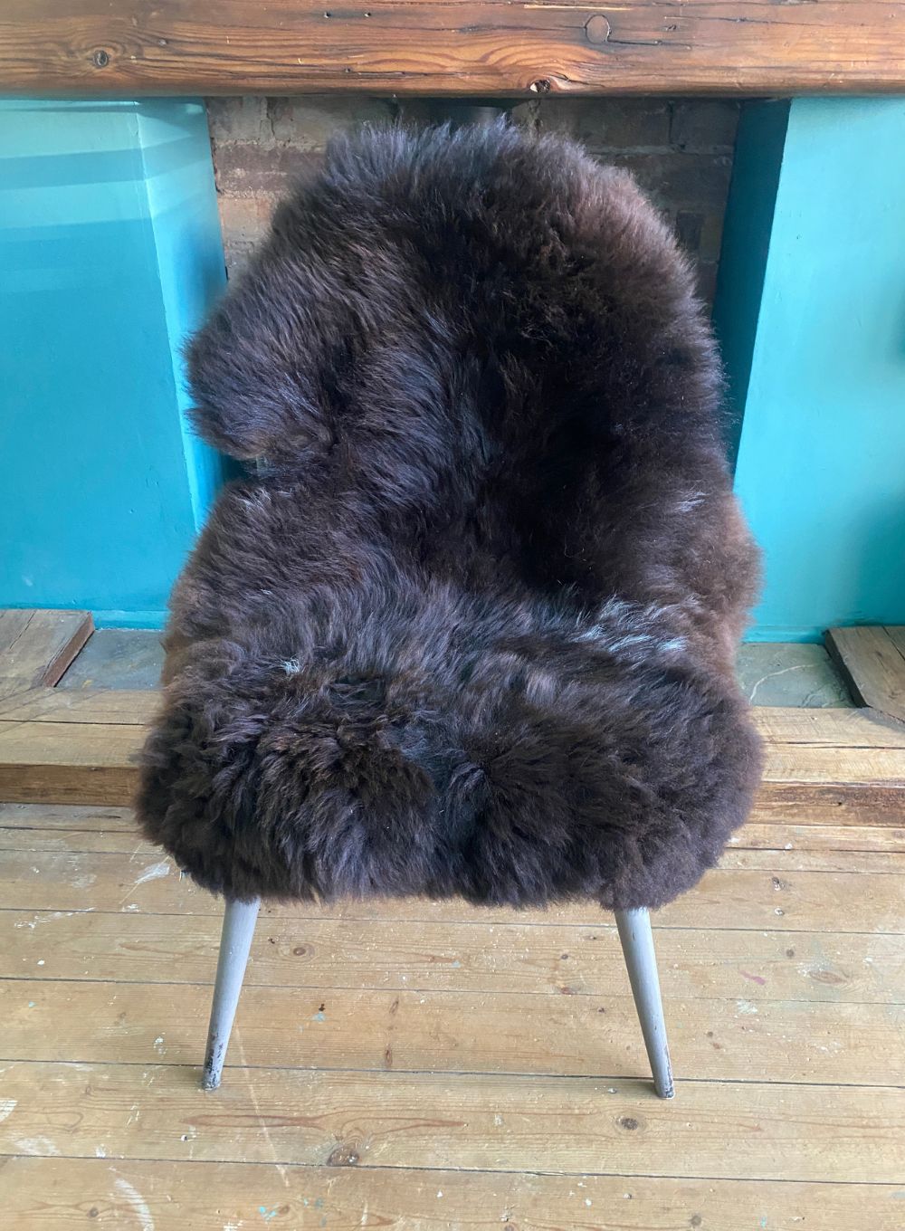 Brown sheepskin rug on chair