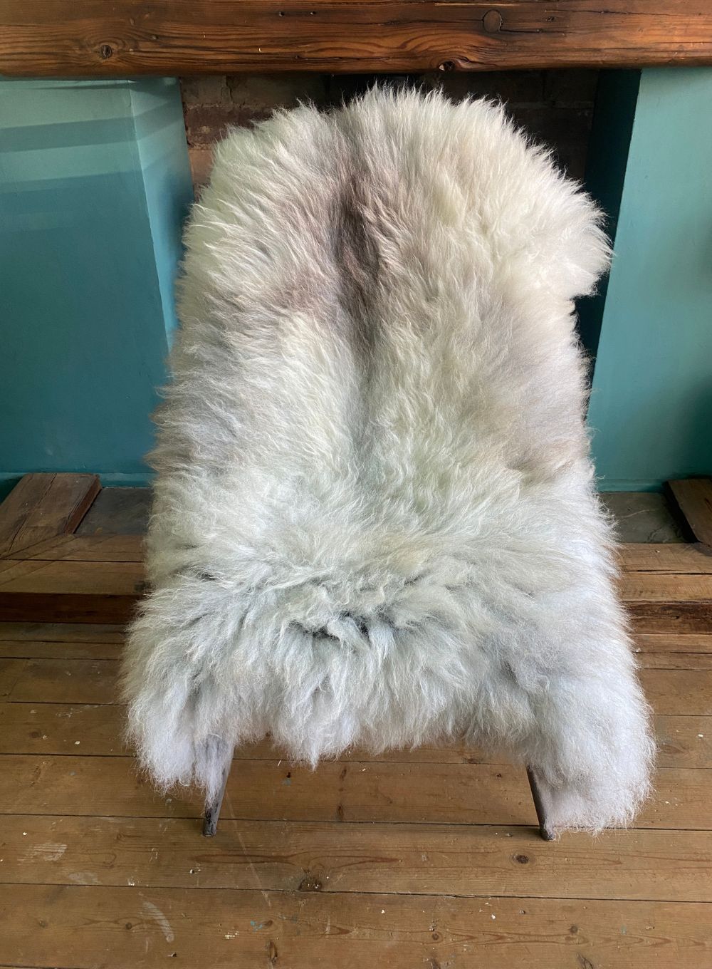 Cream sheepskin rug on chair