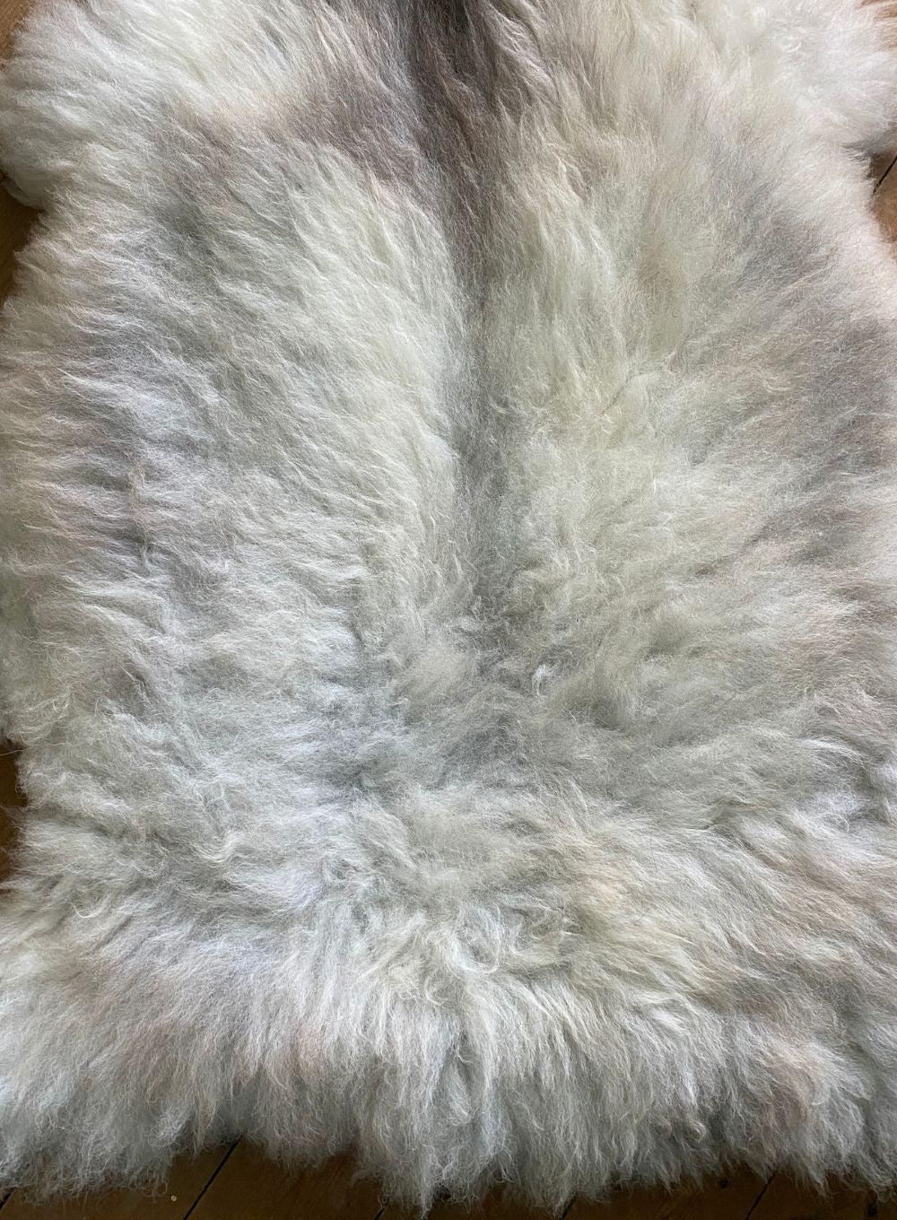 Cream sheepskin rug close up