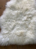 Cream sheepskin rug close up
