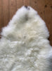 Cream sheepskin rug close up