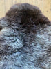 Brown and grey sheepskin rug close up