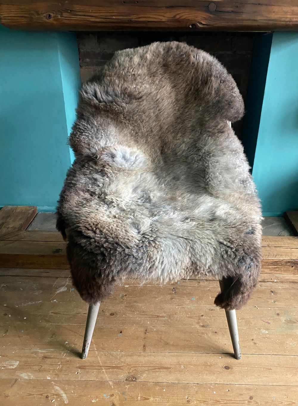 Grey and brown sheepskin rug on chair