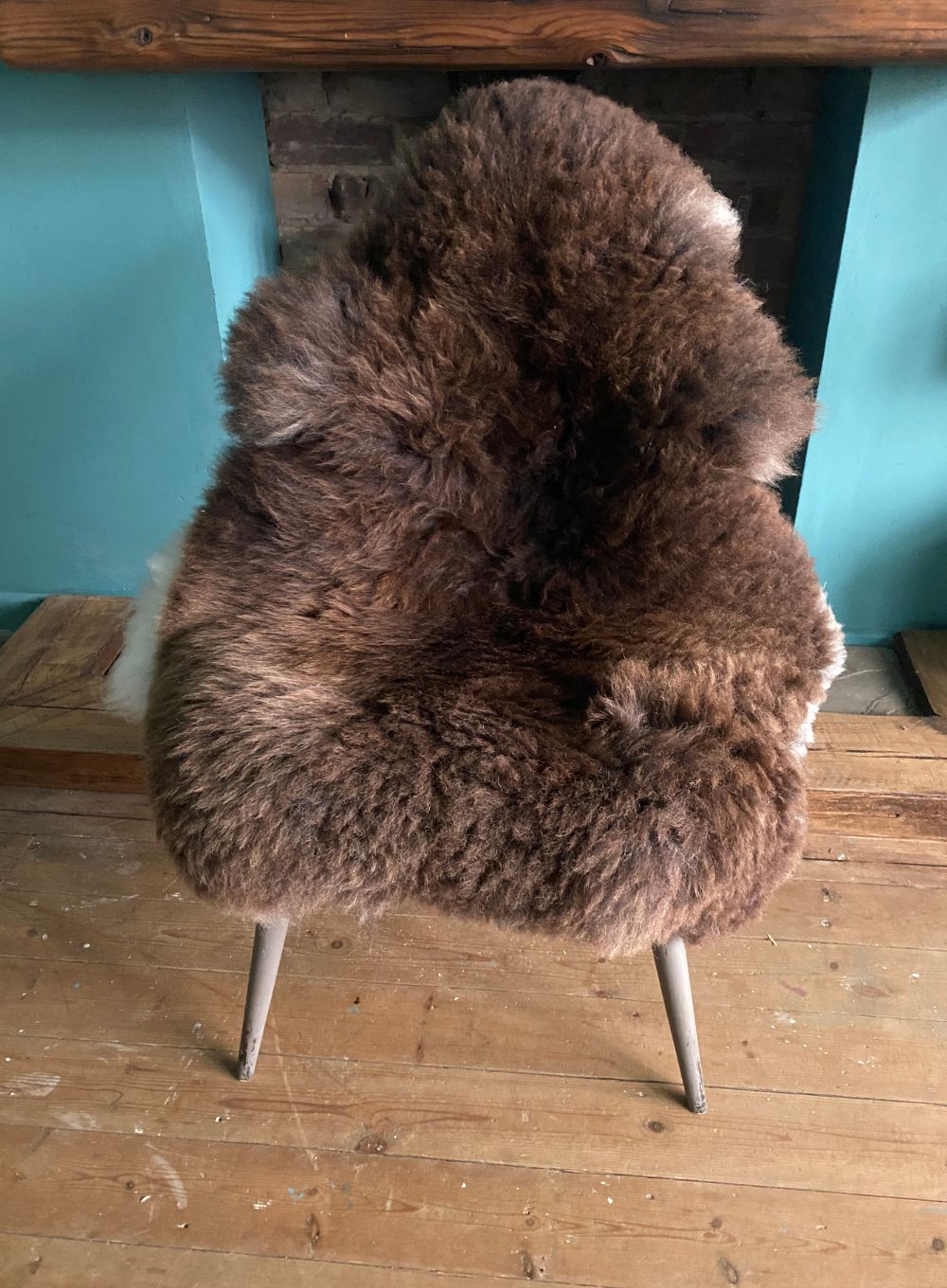 Brown sheepskin rug on chair