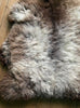 Grey and brown sheepskin rug close up
